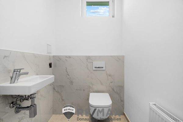 Toilette mit Handwaschbecken