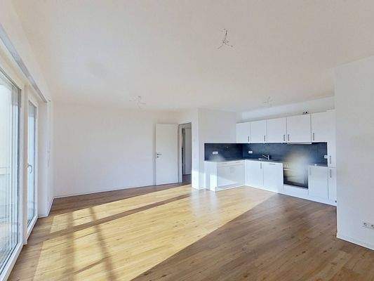 Ansicht III: Wohn- und Esszimmer mit offenem Küchenbereich