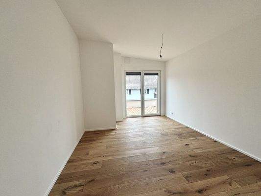 Schlafzimmer mit Zugang zur Terrasse