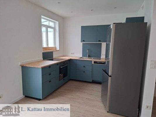 Küche mit einer modernen Einbauküche Obergeschoss