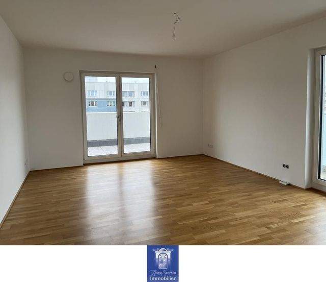 Stilvolle Wohnung mit viel Platz, zwei Bädern und umlaufender Terrasse! - Foto 1