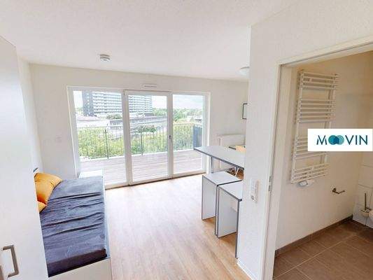 Ansicht I: Wohn- und Schlafzimmer mit offenem Küchenbereich