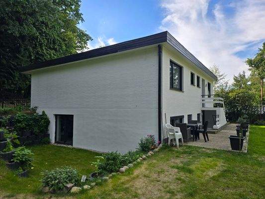 Maison Immobilien Bungalow Buchholz Ansicht UG Terrasse Eingang