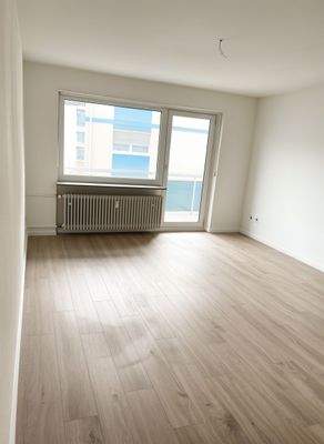 Wohnzimmer mit Balkon