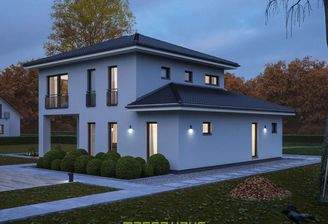 Stimmungsvolle Rückansicht einer modernen massa haus Fertighaus-Stadtvilla bei Dämmerung, die durch
