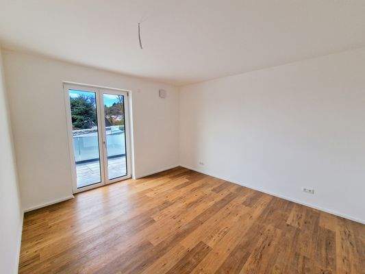 Schlafzimmer mit Balkonzugang