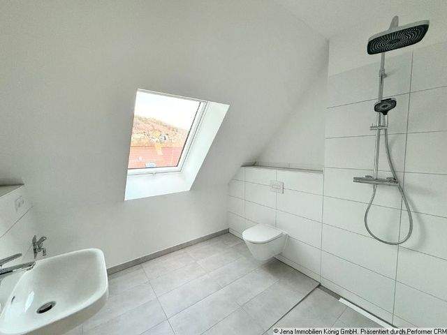 Erstbezug! Zentrumsnahes Einzimmerapartment mit Balkon, Einbauküche und Kamin - Photo 3