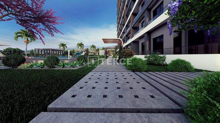 New Apartments in Mersin with a Pool and Modern Landscaping