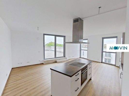 Ansicht I: Wohn- und Esszimmer mit offenem Küchenbereich