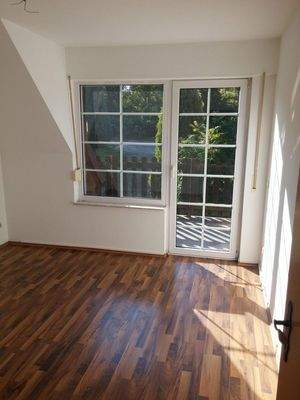 Schlafzimmer mit Balkonzugang