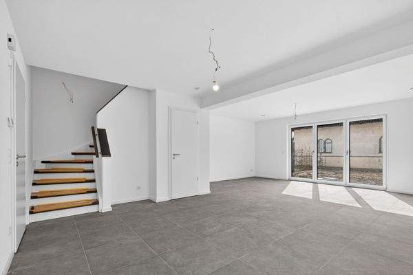 Wohn-Essbereich und Treppenhaus