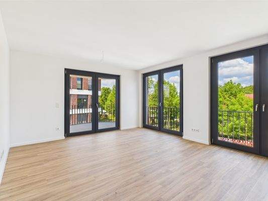 Wohnzimmer + Zugang zur Loggia