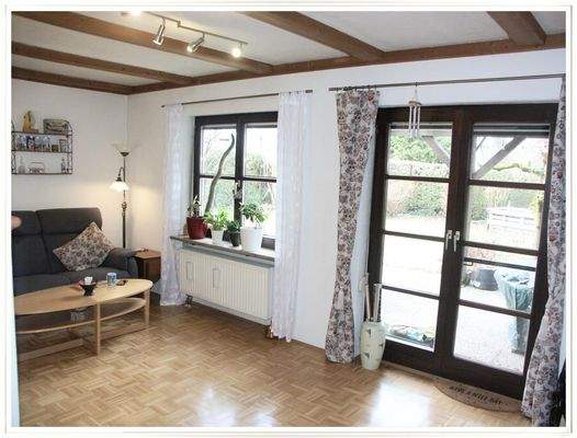 EG: Wohnzimmer mit Westterrasse...