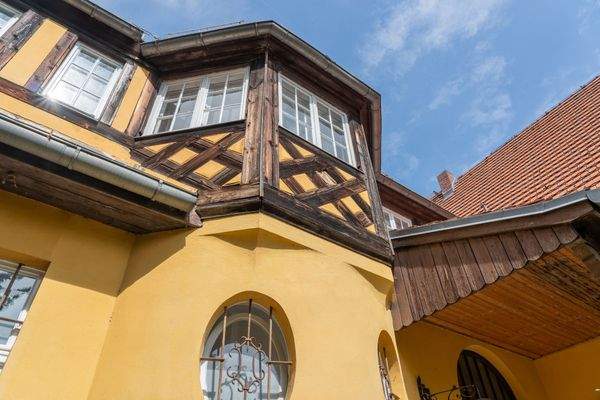 With striking half-timbered elements  