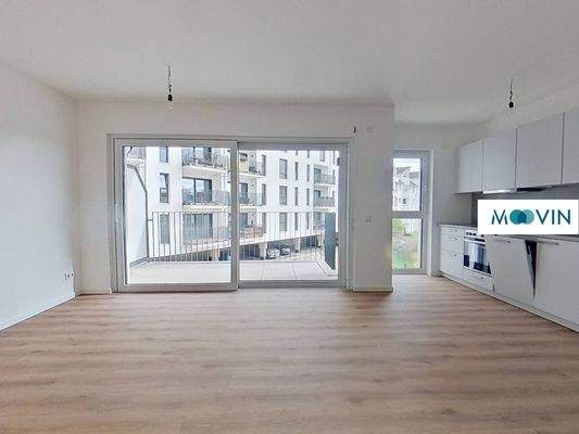 Ansicht I: Wohn- und Esszimmer mit offenem Küchenbereich