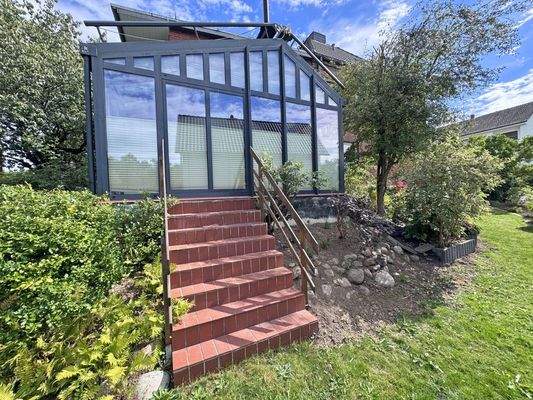 Zugang in den Garten vom Wintergarten