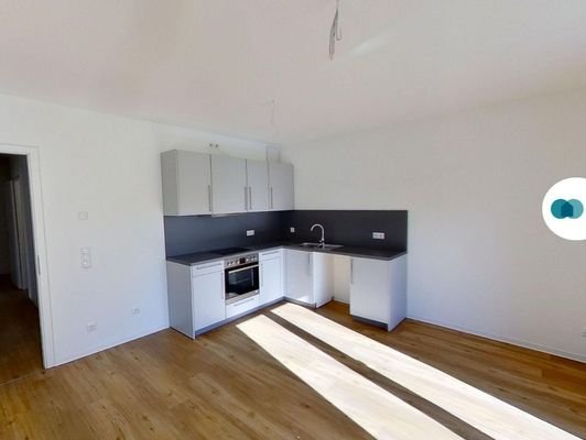 Ansicht III: Wohn- und Esszimmer mit offenem Küchenbereich