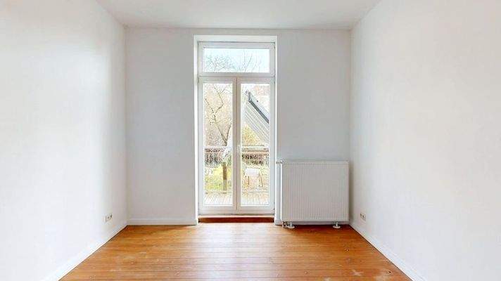 Schlafzimmer mit Balkonzugang