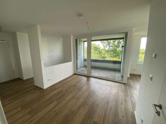 Musterfoto_Wohnzimmer mit offener Küche