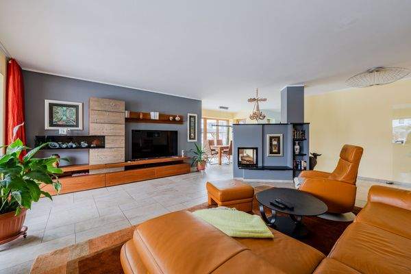 Open-plan living room with fireplace 