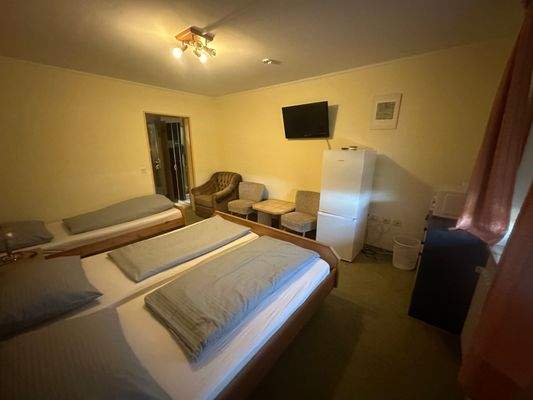 Drei Bett Zimmer
