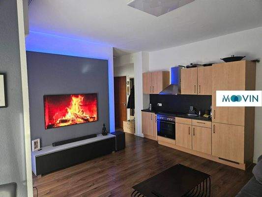 Ansicht II: Wohn- und Esszimmer mit offenem Küchenbereich