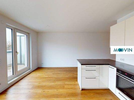 Ansicht III: Wohn- und Esszimmer mit offenem Küchenbereich