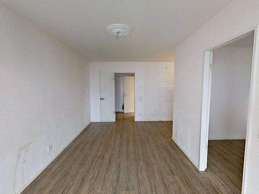 Ansicht II: Wohn- und Esszimmer mit offenem Küchenbereich