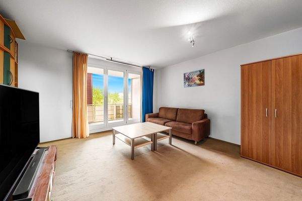 Wohnenzimmer mit Balkonzugang