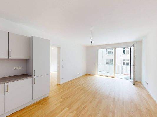 Ansicht II: Wohn- und Esszimmer mit offenem Küchenbereich