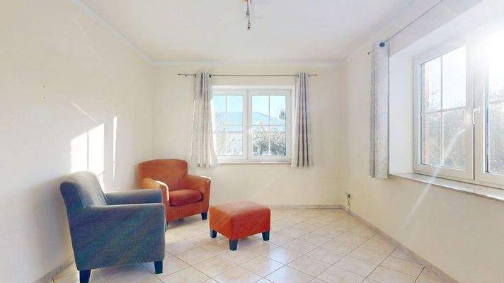 Wohnzimmer mit Wintergarten & Kamin