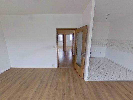 Ansicht IV: Wohn- und Esszimmer mit offenem Küchenbereich