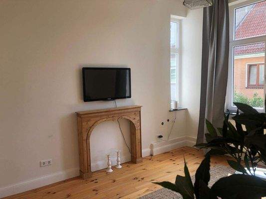 Wohnzimmer mit Kamin.jpeg