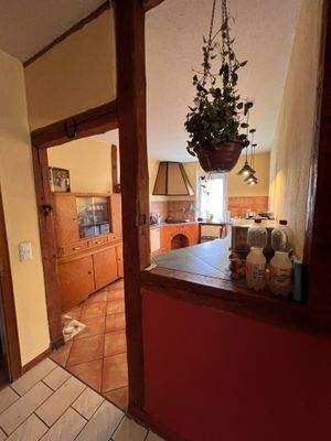 Küche mit Ess- und Wohnzimmer