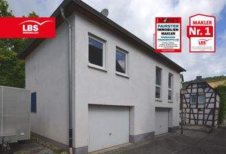 Neubauteil  mit ebenerdigen Garagen