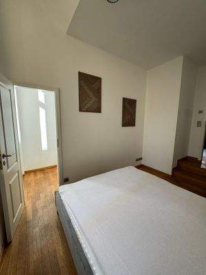 Schlafzimmer mit begehbarem Kleiderschrank