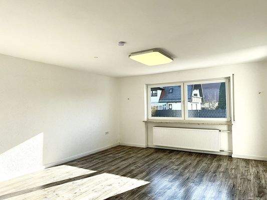 Wohnzimmer mit Zugang auf die Terrasse