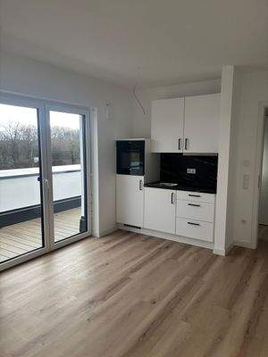 Zimmer mit Einbauküche