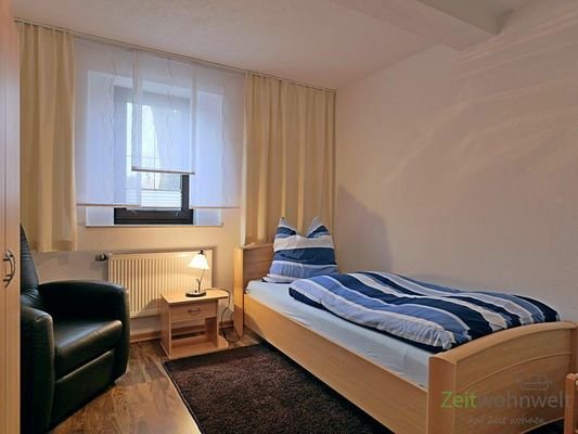 Schlafzimmer mit Sessel