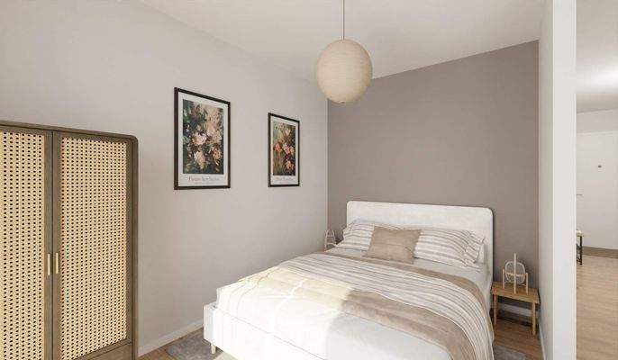 Ein gemütlicher Schlafbereich mit Blick zum Balkon