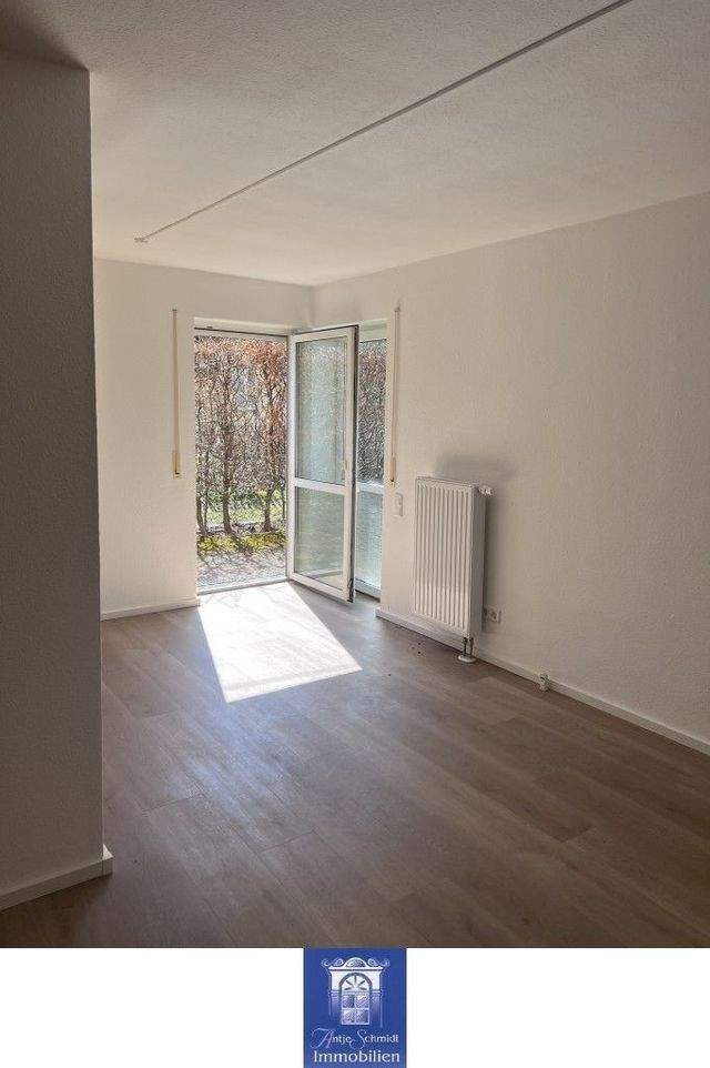 Hübsche Wohnung mit großer Terrasse in grüner und ruhiger Lage! - Foto 1