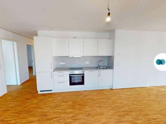 Ansicht II: Wohn- und Esszimmer mit offenem Küchenbereich