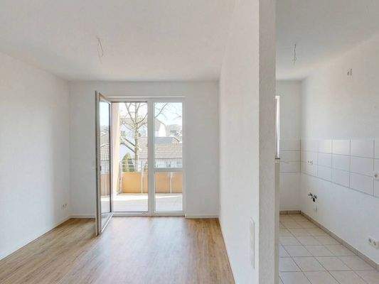 Ansicht II: Wohn- und Esszimmer mit offenem Küchenbereich