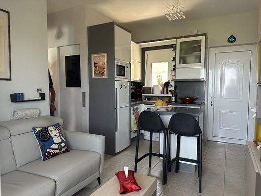 Kreta, Agia Triada: Charmantes Apartment mit Gemeinschaftspool und Meerblick zu verkaufen