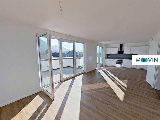 Ansicht I: Wohn- und Esszimmer mit offenem Küchenbereich