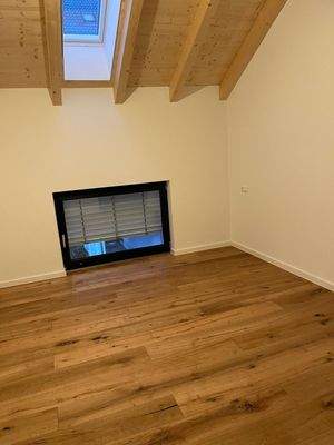 Dachzimmer mit Holzdecke