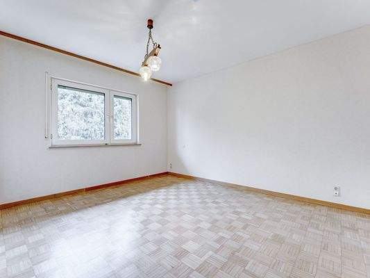 Schlafzimmer mit Parkettboden