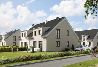 Das Doppelhaus in seiner grünen Umgebung
