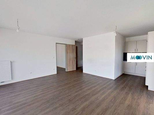 Ansicht IV: Wohn- und Esszimmer mit offenem Küchenbereich