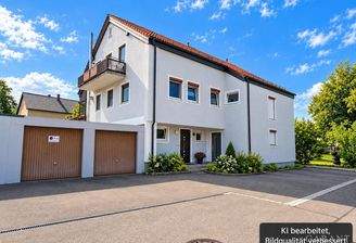 Modernes Mehrfamilienhaus mit Garten